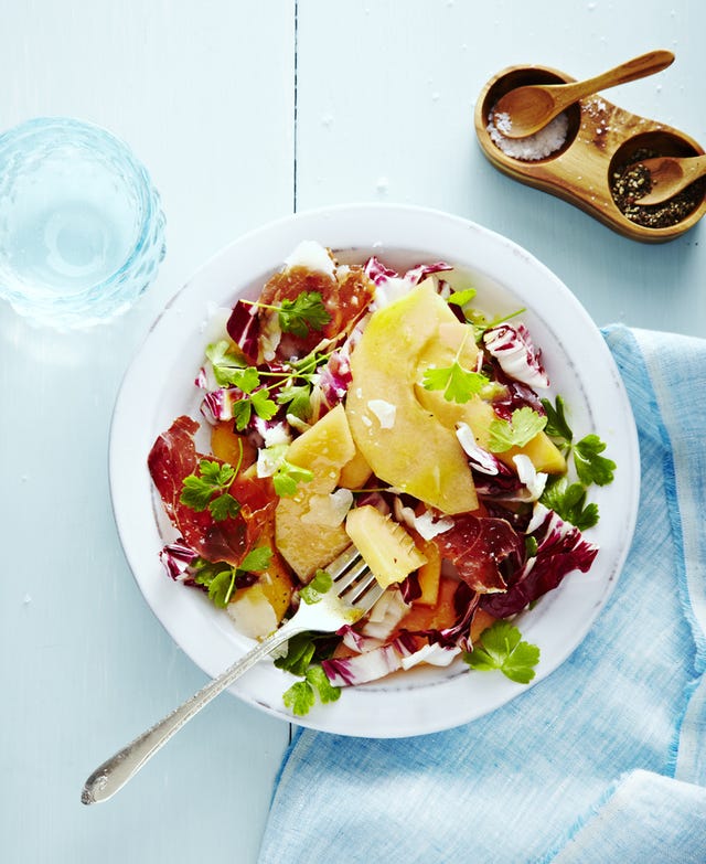 radicchio melon salad with parsley and cheese and served in a white bowl