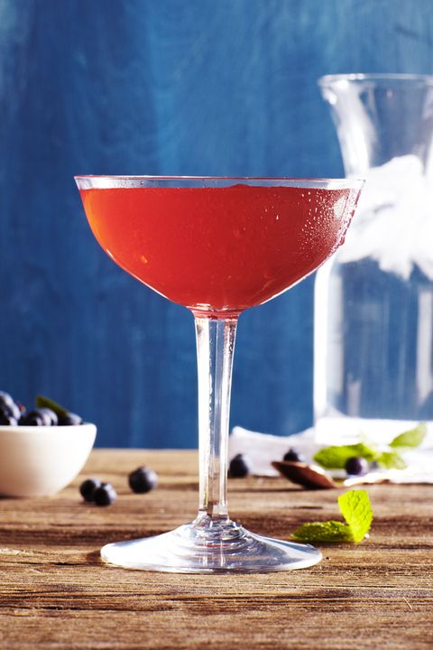 a red tall cocktail in a glass