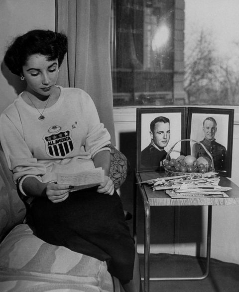 Reading a letter from her boyfriend, Glenn Davis, in 1948. 
