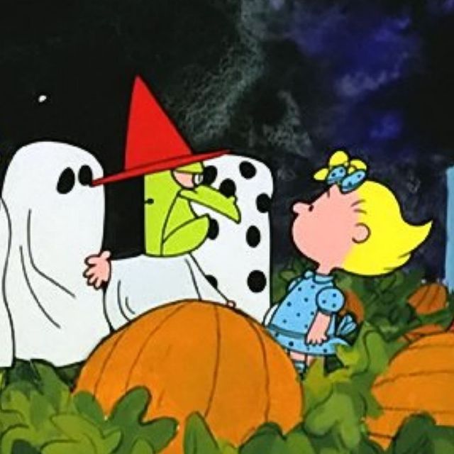 the peanuts gang wear costumes and gather in a pumpkin patch in a scene from 'it's the great pumpkin, charlie brown,' a good housekeeping pick for best halloween movies for kids