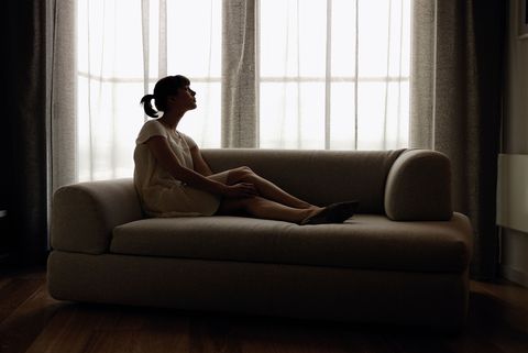 woman alone on couch