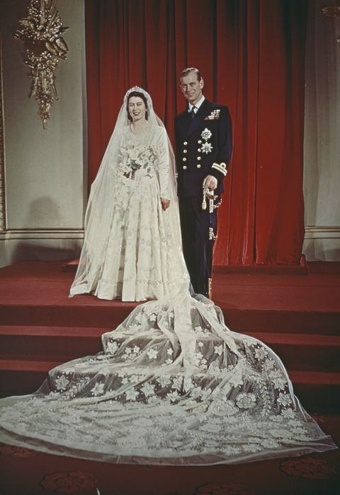 Princess Elizabeth and Prince Philip, Duke of Edinburgh pose together at Buckingham Palace after their wedding ceremony at Westminster Abbey in London on 20th November 1947. Elizabeth wears a wedding gown designed by Norman Hartnell.