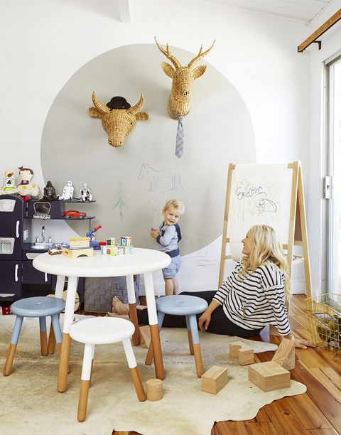 <p>"We needed a space suitable for grown-ups, but cheerful enough for a child," Emily says. "The circle on the wall [which is  clear chalkboard paint] was a graphic, sophisticated way to add playfulness. Wicker animal heads make it fun, and the neutral tones keep it from being too 'day-care.'"</p><p><em>Woven taxidermy heads, $40 each, and gray woven storage basket, $24, </em><a href="http://target.com" target="_blank"><em>target.com</em></a><em>. Play table, $375, and stools, $98 each, </em><em><a href="http://serenaandlily.com" target="_blank">serenaandlily.com</a>. Chalkboard paint, $10, <a href="When Emily Henderson (who's expecting baby number two) invited us over, we jumped at the chance to see her newly refreshed family home and steal some secrets. " target="_blank">homedepot.com</a>.</em><em></em></p>