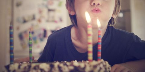 Boy Blowing Out Birthday Candles