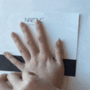 Finger, Skin, Nail, Thumb, Wrist, Gesture, Material property, Rectangle, Square, Paper, 
