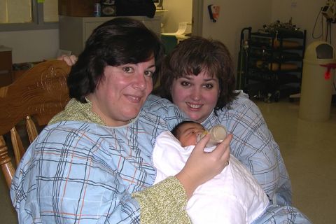 Jodi and Kimberly meeting their daughter Grace for the first time.