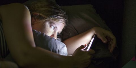 Woman in Bed With Smartphone