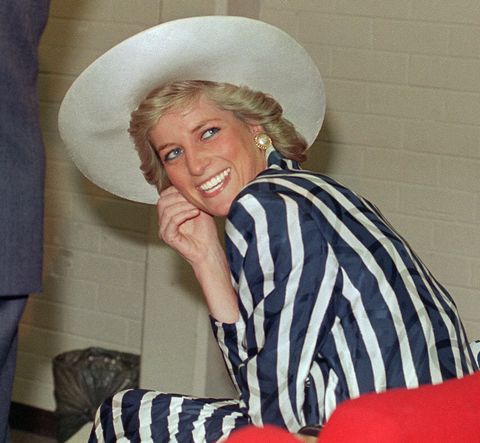 Princess Diana in red pants and striped shirt