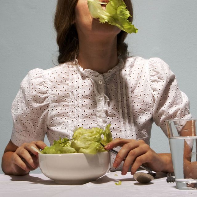 Woman Eating Lettuce