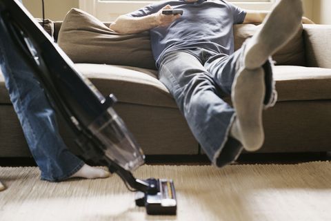 couple vacuum housework chores fight arguing