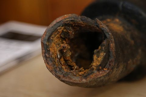 Jan. 30, 2016 - Flint, Michigan, U.S. - A pipe VERONICA KELLEY, of Flint, removed from her home showing corrosion, seen during a sharing podium for Flint residents about their legal rights in the the Flint water crisis at Quinn Chapel AME church.