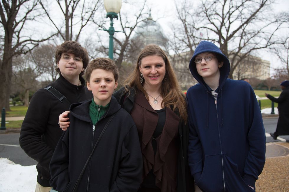 Melissa Mays poses with sons Caleb (age 17), Cole (11) and Christian (12)near the entrance to the Rayburn House Office Building. Melissa Mays is the founder of Flint-based clean water advocacy group WaterYouFightingFor. She and others from Flint have filed a lawsuit claiming their homes and bodies were damaged by the water, leaving them with skin lesions, hair loss, convulsions and other health issues. Inside, the U.S. House of Representatives' Committee on Oversight and Government Reform focused for the first time on Flint Michigan's water crisis at a hearing on Capitol Hill in Washington D.C. on Wednesday February 3, 2016. Lawmakers grilled federal and state officials about actions that have resulted in fears of lead poisoning in children, blaming the crisis in varying degrees as a failure of government at all levels Several residents of Flint attended the hearing. Many were angry that the Governor of Michigan, Rick Snyder (R), was not called upon to testify.