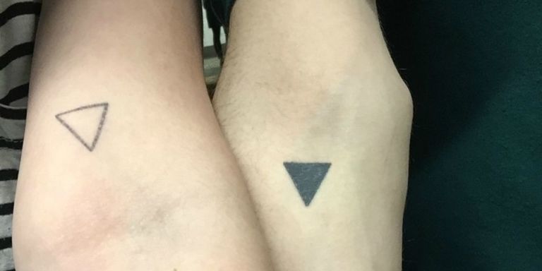 Minimalistic triangle tattoo done on the tricep, fine