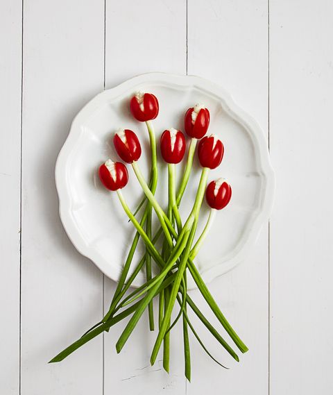 red tulips made from tomatoes and green scallions