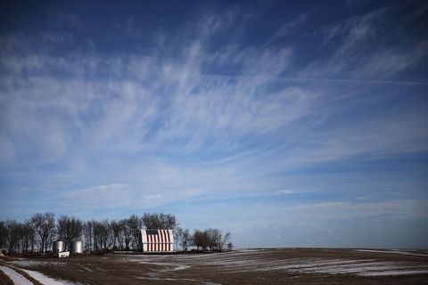 An American flag is seen painted on a barn on January 30, 2016 outside of Des Moines, Iowa. Candidates who are seeking the nominations from the Republican and Democratic Party are touring the state campaigning for votes before the Iowa caucus that takes place on February 1.