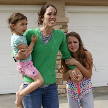 MARCH 21: Summer Page runs out of her home screaming. Social workers took her foster child way. She and her children watch as she is driven away. While down the street protestors sang Amazing Grace in Santa Clarita, CA March 21, 2016. A group is participating in a group prayers each hour, and singing together. Some people in the crowd are crying. Many in the group say they are part of the families church community. They say they will remain in a Santa Clarita neighborhood tonight to demonstrate against authorities' plans to take a 6-year-old girl from her foster family's custody and place her with Choctaw Nation blood relatives who live in Utah. They friends and members of a church community supporting Rusty Page and his family. They have asked for more people to join in and support the group.