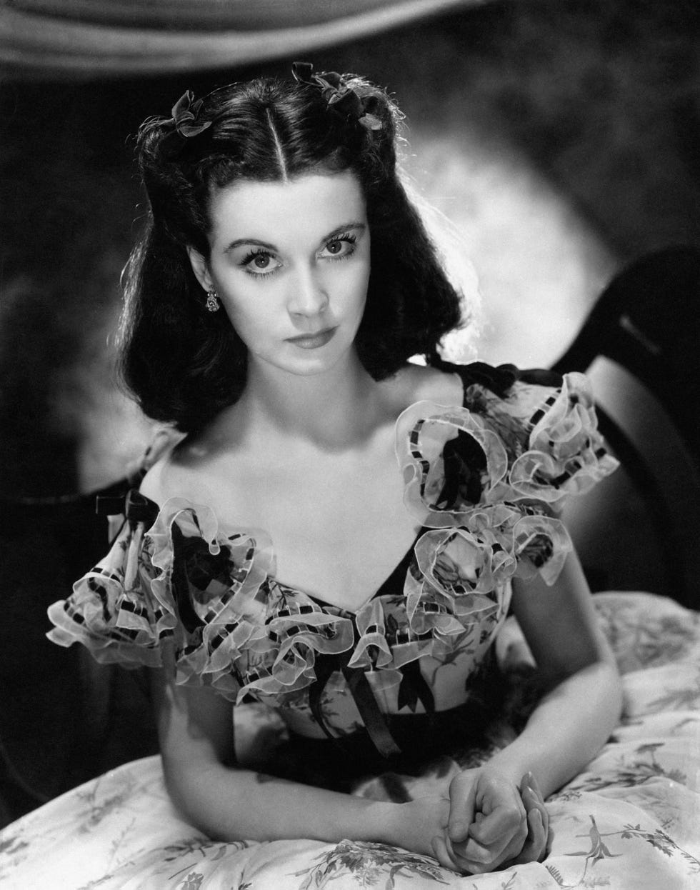 Vivien Leigh's famous portrayal of Scarlett O'Hara in Gone with the Wind featured a throwback Southern belle look with rolled-back hair.