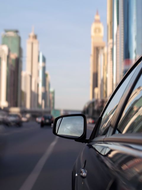 Automotive mirror, Motor vehicle, Mode of transport, Automotive design, Daytime, Glass, Automotive side-view mirror, Road, Rear-view mirror, Reflection, 