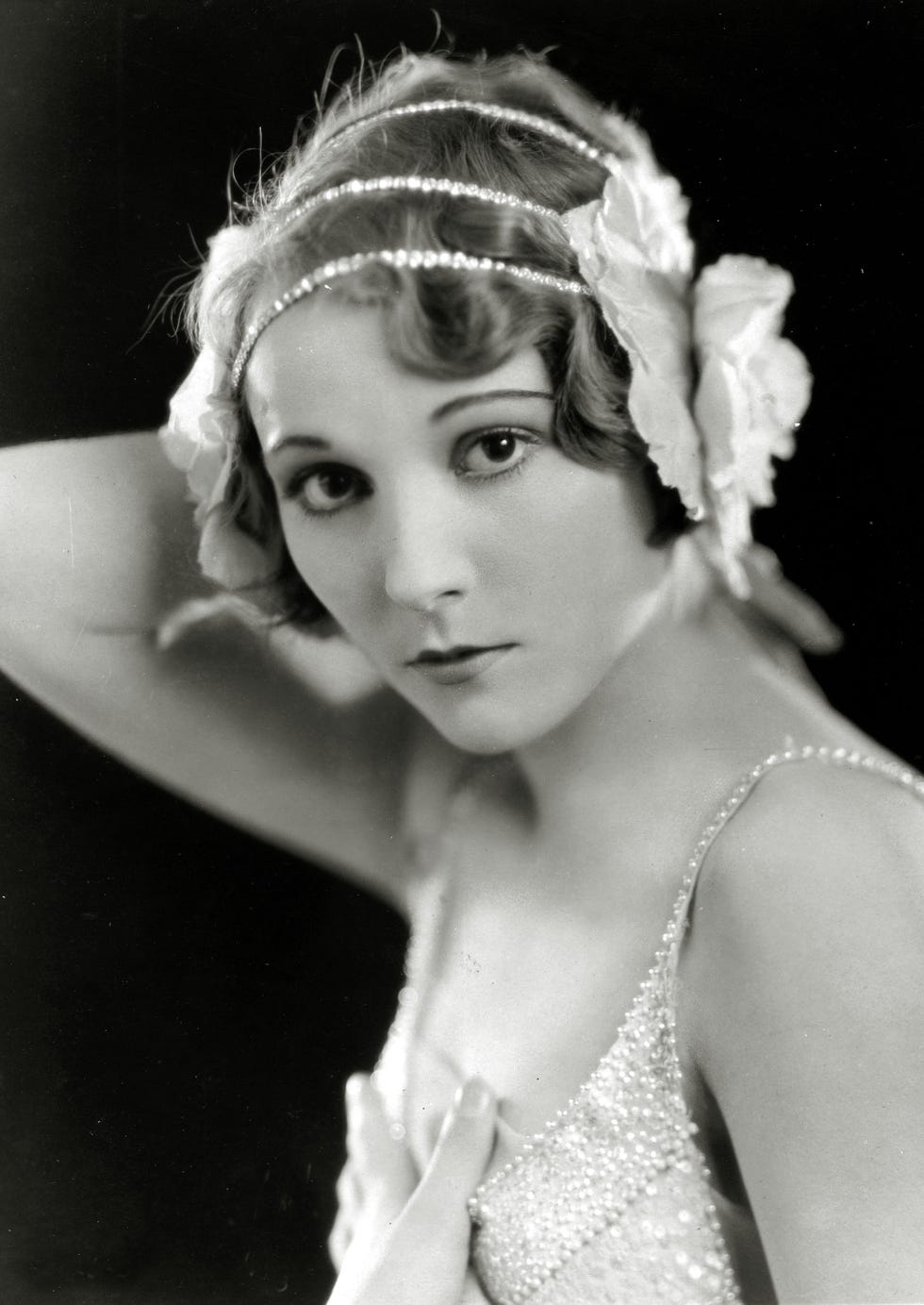 A thin, sometimes jeweled piece of fabric worn around the forehead, this style was dubbed the "headache band" — not exactly an appealing accessory nickname, but it looks so chic!