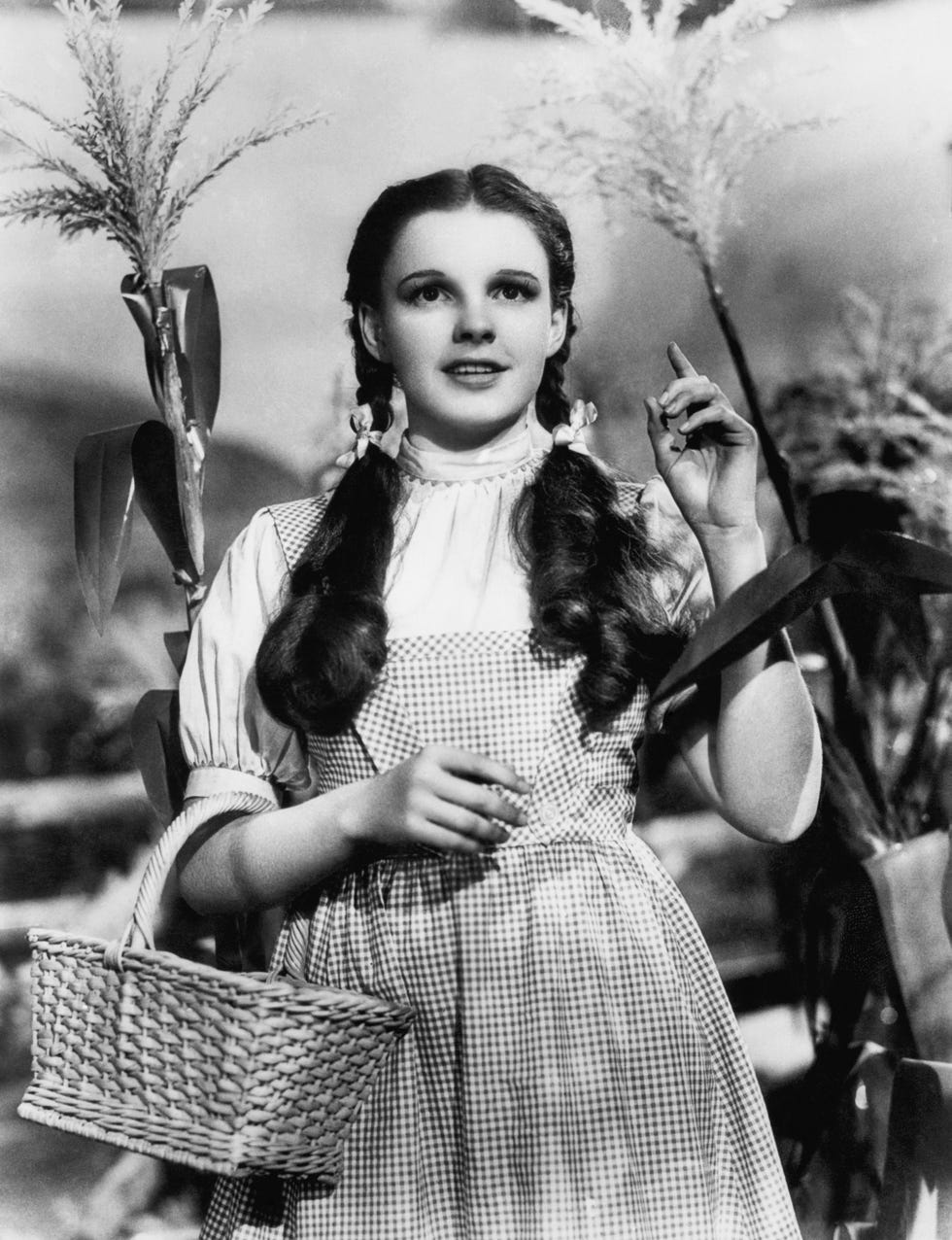 starring in her most famous role as dorothy in 1938's wildly popular wizard of oz, judy garland helped popularize the curly pigtail look