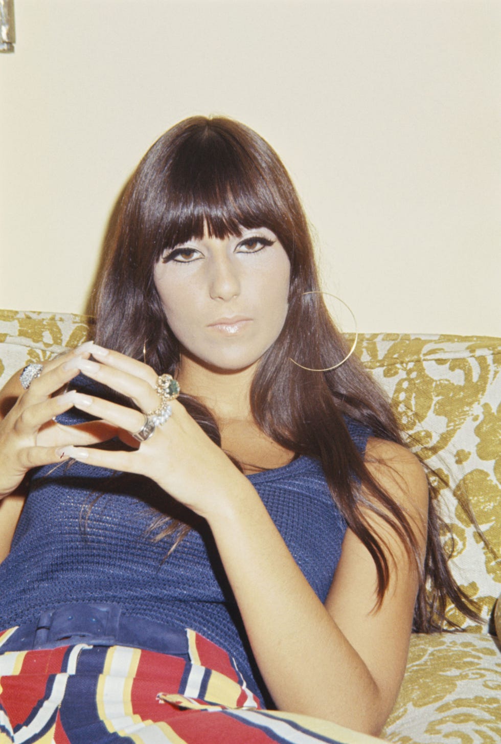 as hippies influenced mainstream style, women flocked to copy the ever trendsetting cher by wearing their hair long, straight, and silky