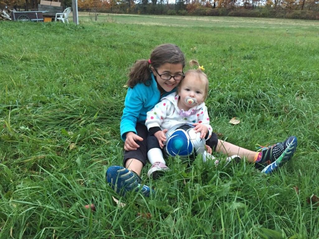 Human, Leg, Grass, Shoe, Child, People in nature, Baby & toddler clothing, Land lot, Sneakers, Grassland, 