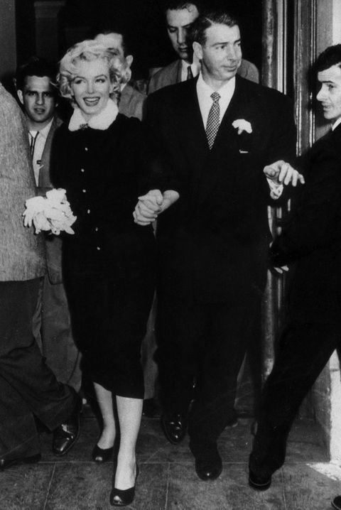 The American actress Marilyn Monroe and her husband Joe DiMaggio leaving the town hall after their wedding. San Francisco, 14th January 1954 (Photo by Mondadori Portfolio via Getty Images)