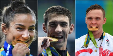 Olympians Biting Medals