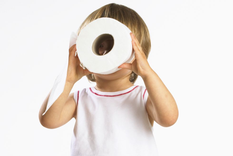 kid looking through toilet paper