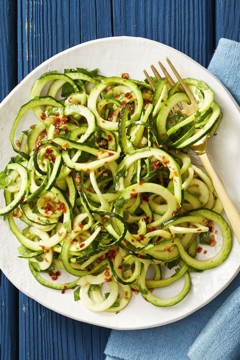 asian sesame zucchini noodles on a white plate