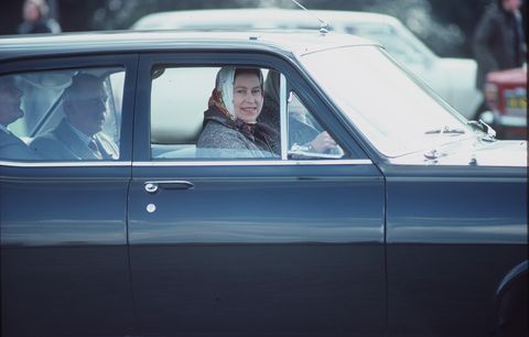 Queen Elizabeth driving a Vauxhall