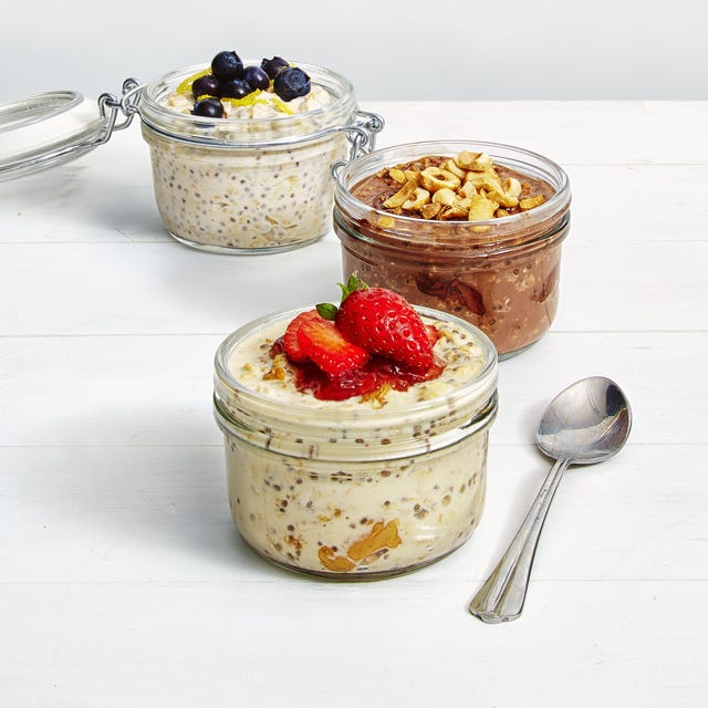 chilled overnight chia pudding in three jars with fruit on top