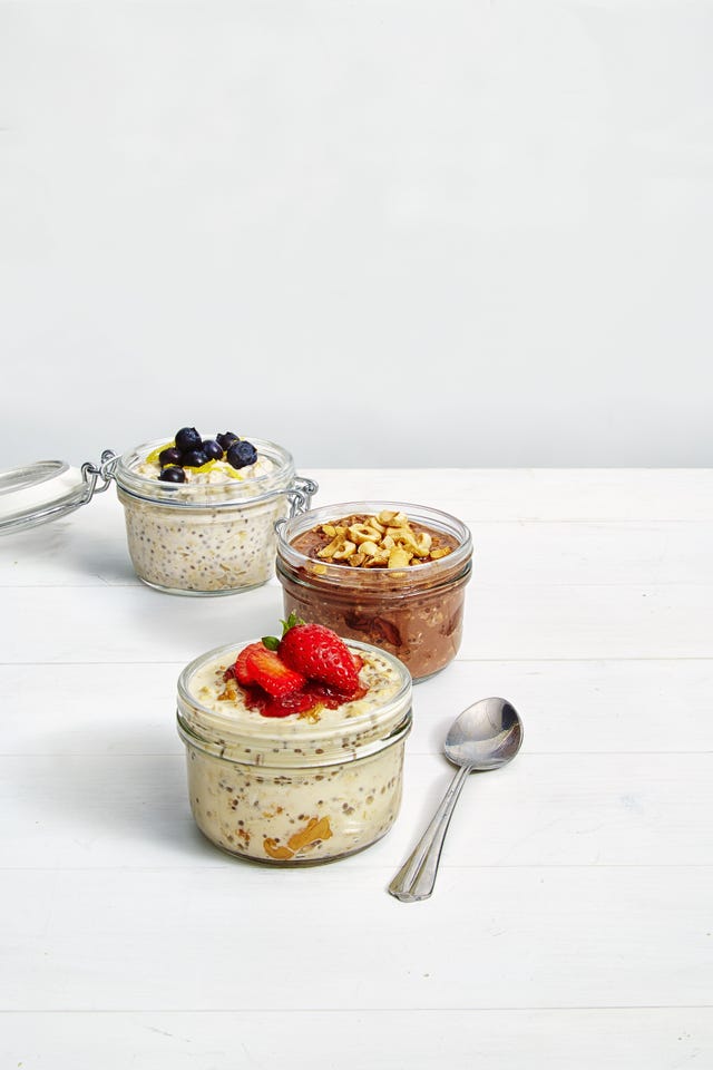 chilled overnight chia pudding in three jars with fruit on top