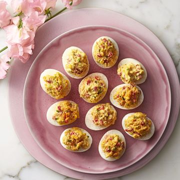 pimiento cheese deviled eggs on a pink plate