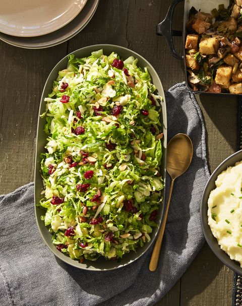 lemony brussels sprout salad with dried cranberries on top