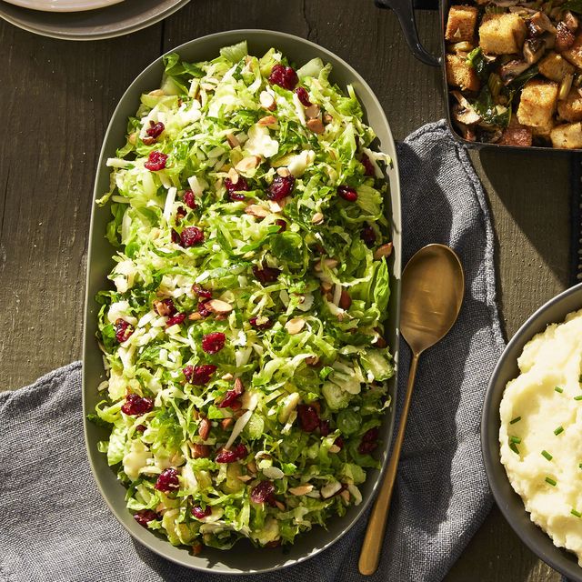 lemony brussels sprout salad with dried cranberries on top