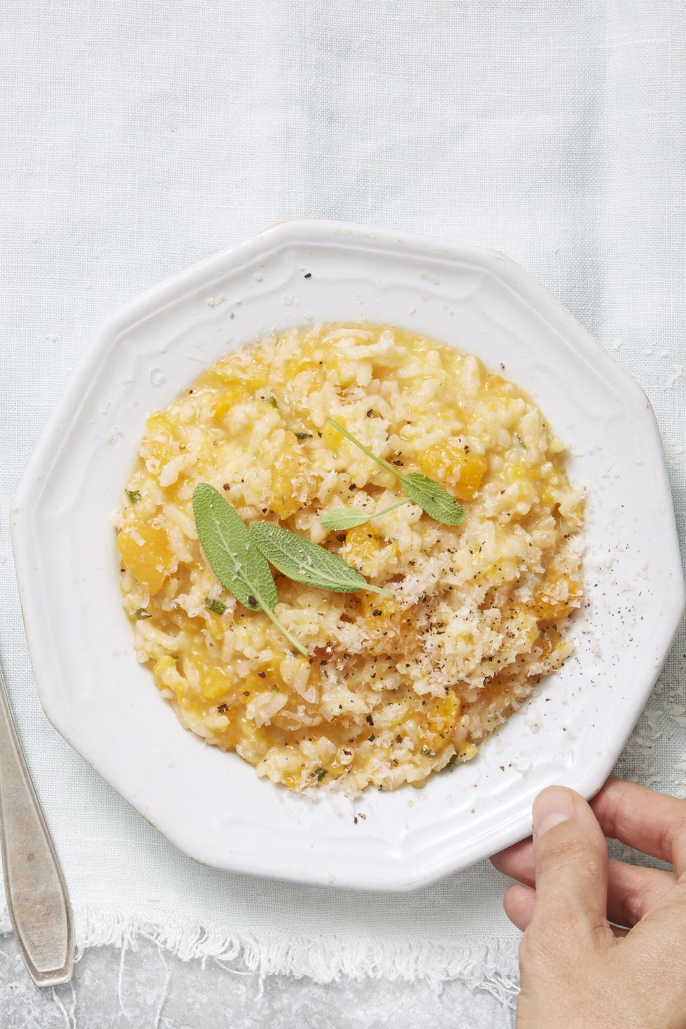 butternut squash risotto on a white plate