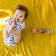 Finger, Product, Yellow, Child, Happy, Facial expression, Baby & toddler clothing, Toddler, Baby, Thumb, 