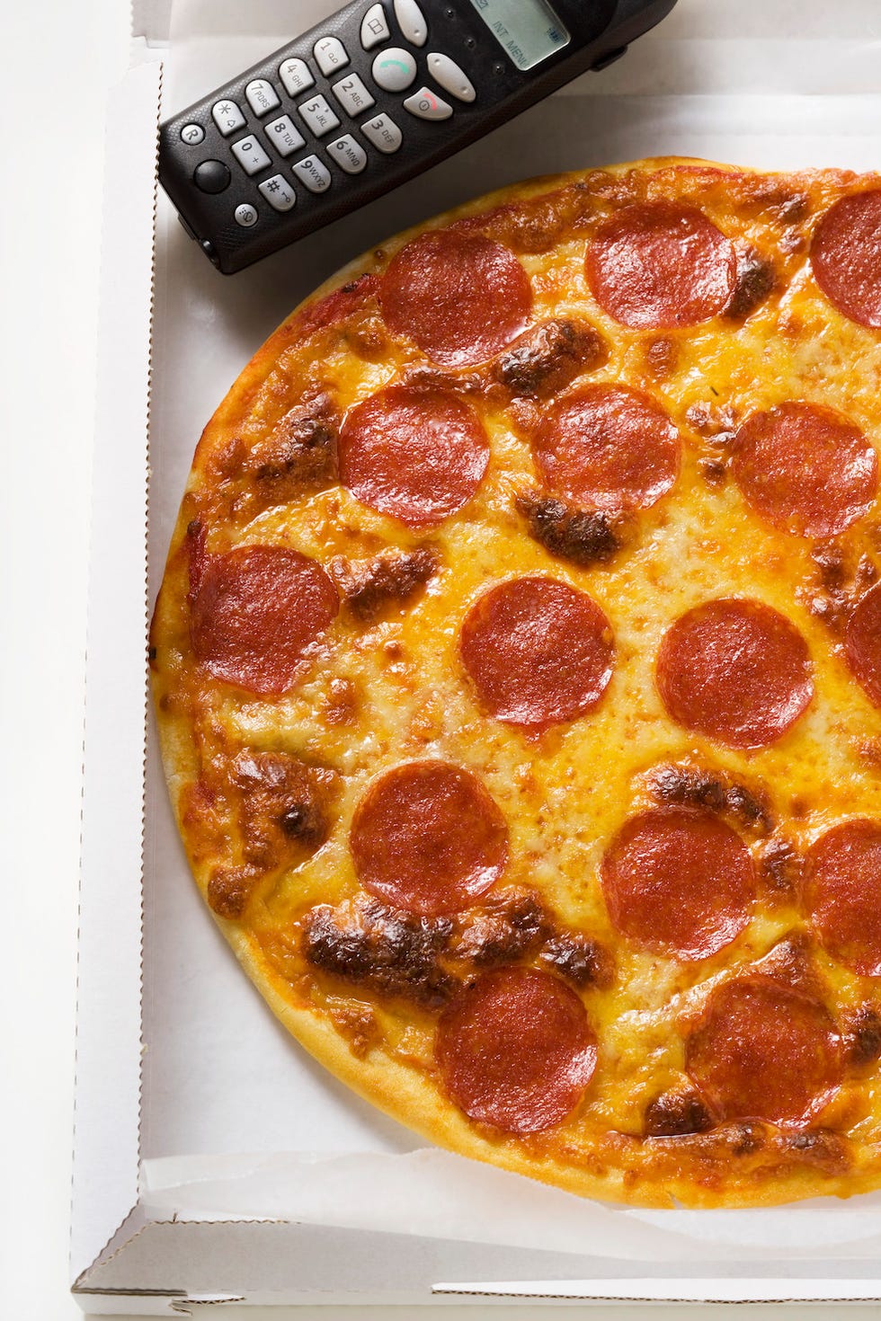 box of pizza with phone