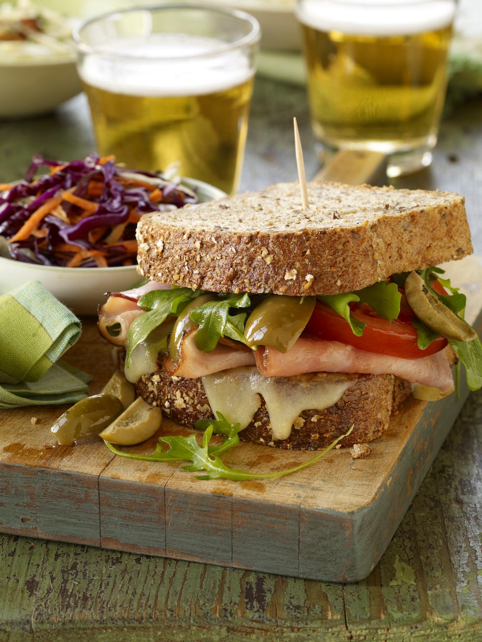 sandwich and two glasses of beer on table