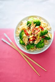 sesame garlic chicken and broccoli over white rice