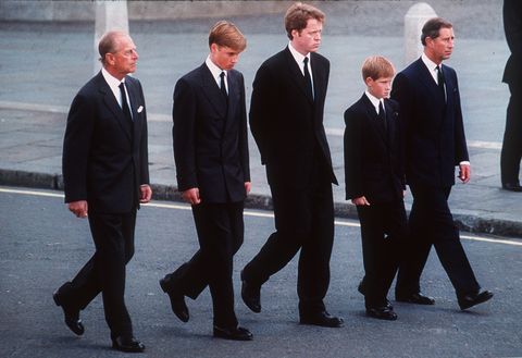 Diana's family walks at her funeral.