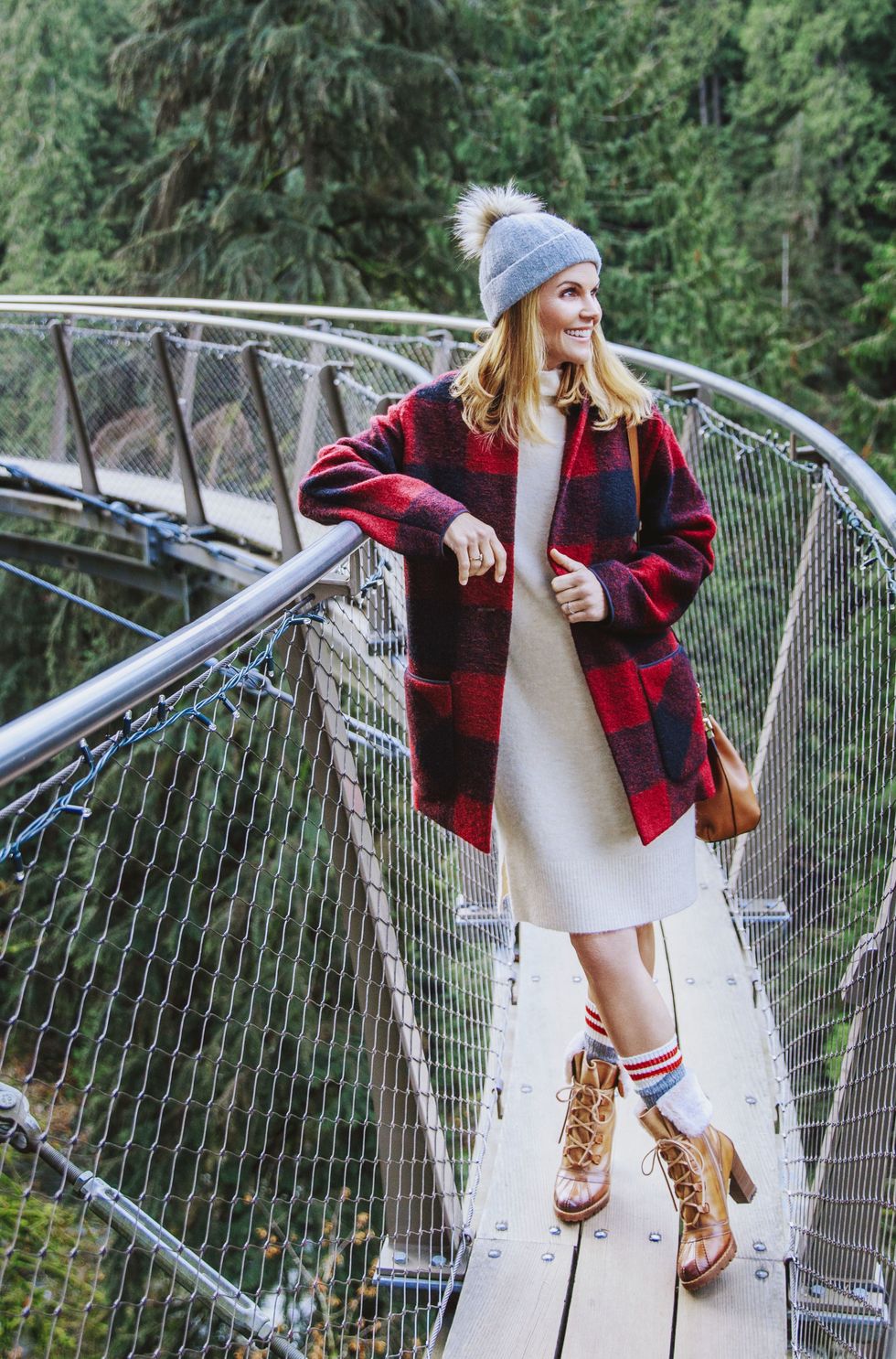 <p>Cozy up in buffalo&nbsp;checks, lug-soled boots or&nbsp;other things fit for a log cabin.</p><p><em data-redactor-tag="em" data-verified="redactor"><strong data-redactor-tag="strong" data-verified="redactor">Sweater coat, </strong>$250, <strong data-redactor-tag="strong" data-verified="redactor">dress, </strong>$98, and <strong data-redactor-tag="strong" data-verified="redactor">hat</strong><strong data-redactor-tag="strong" data-verified="redactor">, </strong>$45, <a href="http://www.aritzia.com" target="_blank" data-tracking-id="recirc-text-link">aritzia.com</a>. <strong data-redactor-tag="strong" data-verified="redactor">Ring,</strong> $10, <a href="http://www.charmingcharlie.com" target="_blank" data-tracking-id="recirc-text-link">charmingcharlie.com</a>. <strong data-redactor-tag="strong" data-verified="redactor">Ring (worn throughout on left hand), </strong>Lori's own. <strong data-redactor-tag="strong" data-verified="redactor">Purse,</strong>&nbsp;$225,&nbsp;<a href="http://www.aritzia.com/" target="_blank" data-tracking-id="recirc-text-link">aritzia.com</a><span class="redactor-invisible-space" data-verified="redactor" data-redactor-tag="span" data-redactor-class="redactor-invisible-space"></span>. <strong data-redactor-tag="strong" data-verified="redactor">Socks (similar), </strong><a href="http://www.roots.com" target="_blank" data-tracking-id="recirc-text-link">roots.com</a></em><em data-redactor-tag="em" data-verified="redactor">. <strong data-redactor-tag="strong" data-verified="redactor">Boots,</strong> $250, <a href="http://pikolinos.com" target="_blank" data-tracking-id="recirc-text-link">pikolinos.com</a>.</em></p><p><strong data-redactor-tag="strong" data-verified="redactor">TRAVEL TIP: </strong>Walk among the&nbsp;treetops at the <a href="http://www.capbridge.com" target="_blank" data-tracking-id="recirc-text-link">Cliffwalk</a>,&nbsp;a series of winding&nbsp;walkways set 300 feet&nbsp;above the Capilano&nbsp;River.&nbsp;</p>