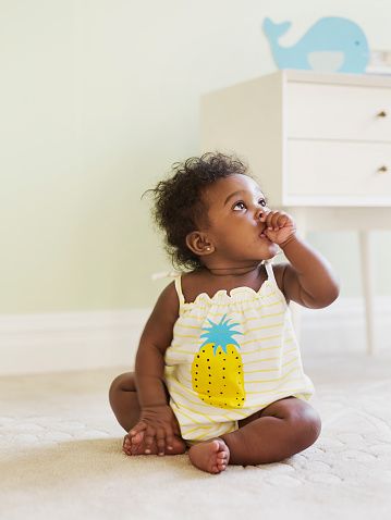 Finger, Skin, Human body, Chest of drawers, Hand, Child, Baby & toddler clothing, Sitting, Drawer, Cabinetry, 