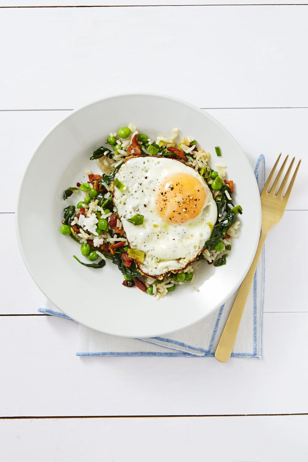 a fried on egg on top of rice