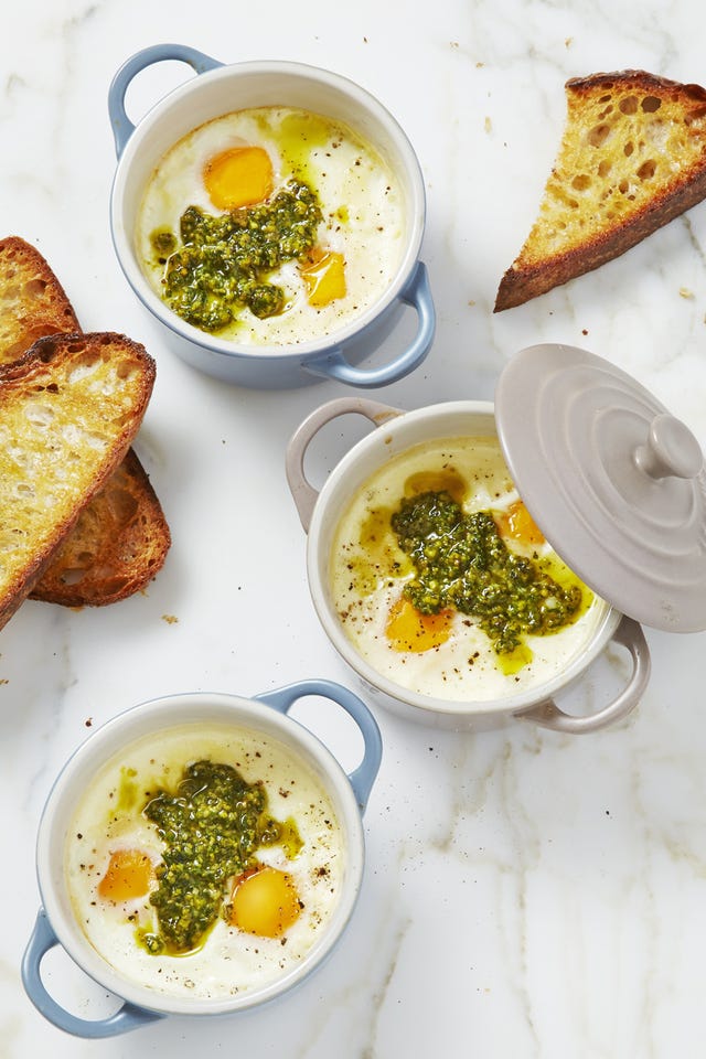 mint pesto baked eggs in individual pots with toast served on the side
