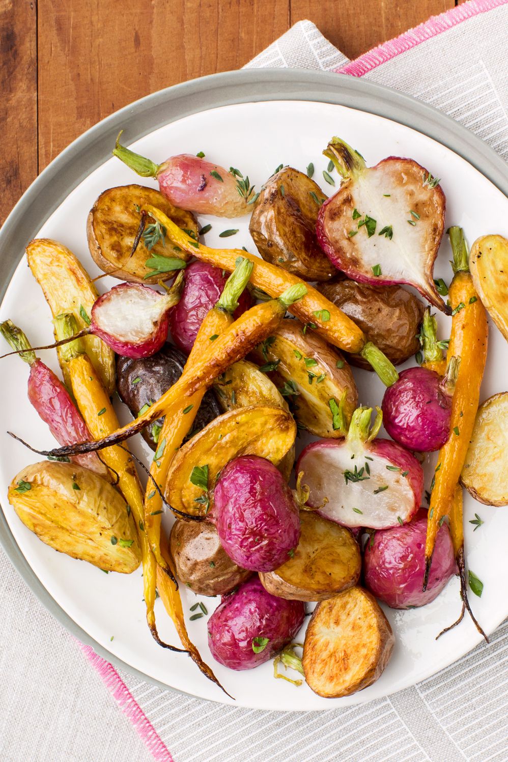 herb roasted root vegetables on a white plate