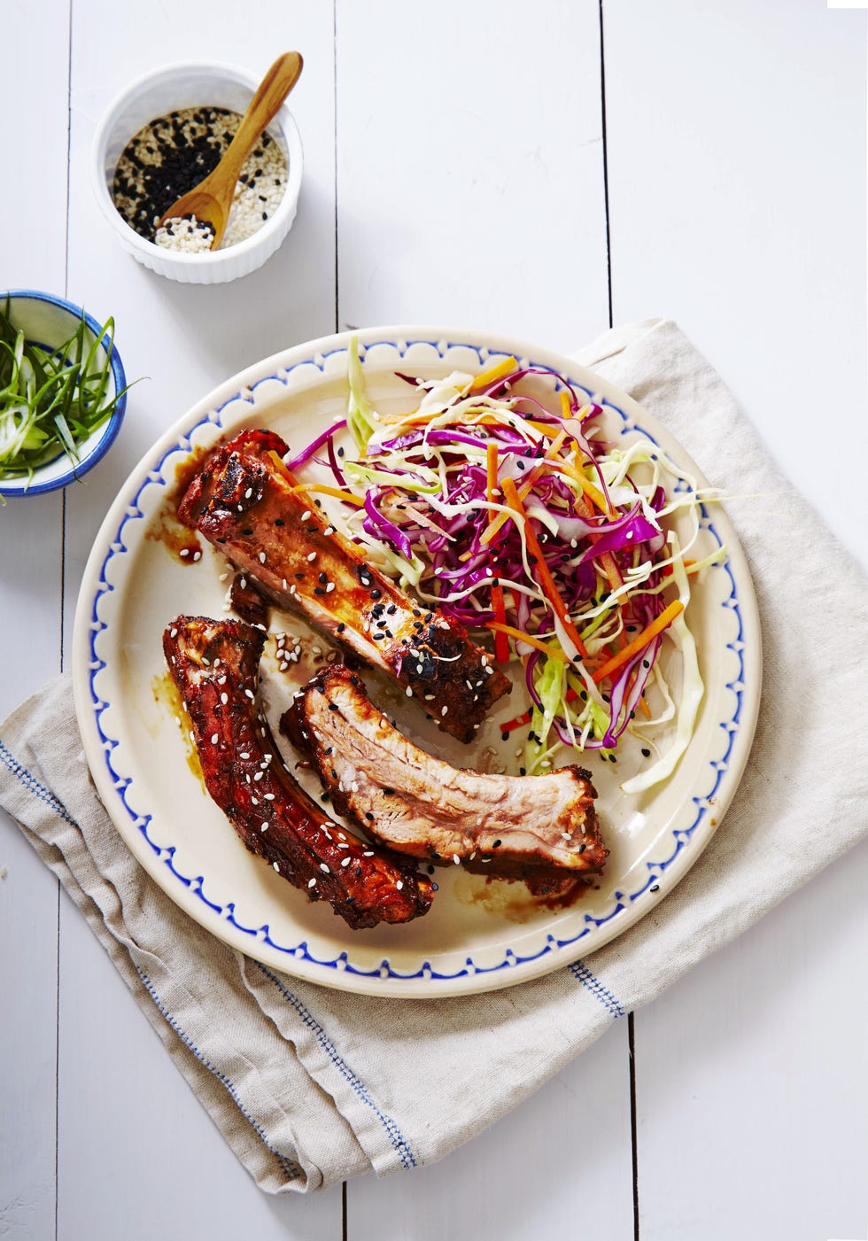 slow cooked teriyaki ribs with a side of coleslaw on a plate
