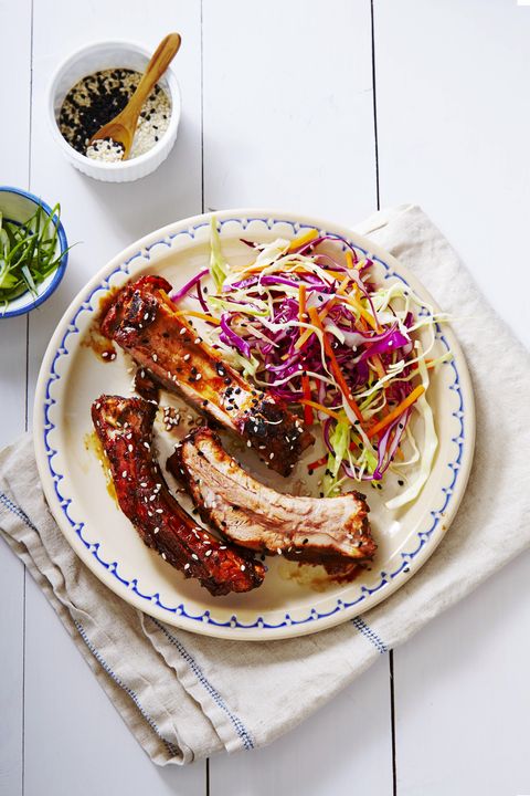slow cooked teriyaki ribs with a side of coleslaw on a plate