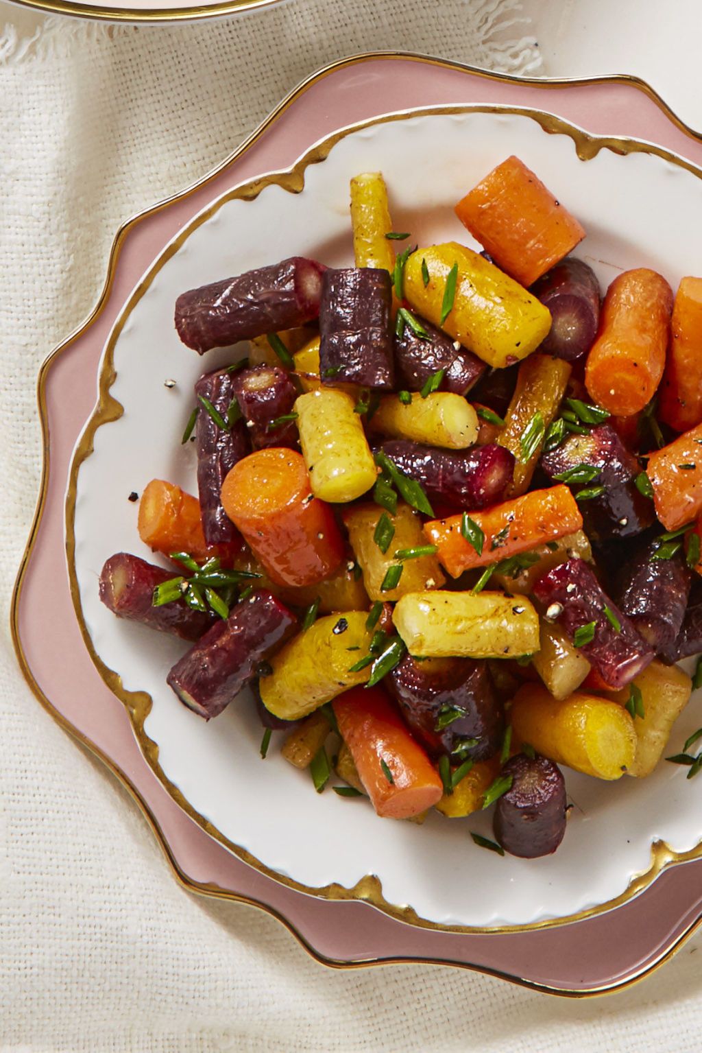 butter glazed rainbow carrots on a white plate